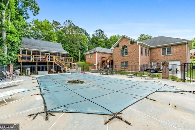 604 Clearwater Ct, Mcdonough, GA 30252 - view of swimming pool featuring stairway and a deck