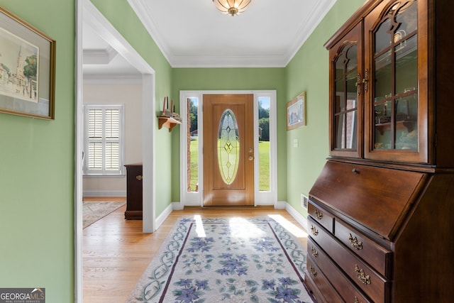 604 Clearwater Ct, Mcdonough, GA 30252 - foyer entrance featuring light wood-style flooring and ornamental molding