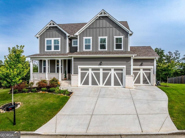 17 Ridgeline Way NW, Cartersville, GA 30121 - craftsman-style house featuring board and batten siding, covered porch, a front yard, concrete driveway, and an attached garage