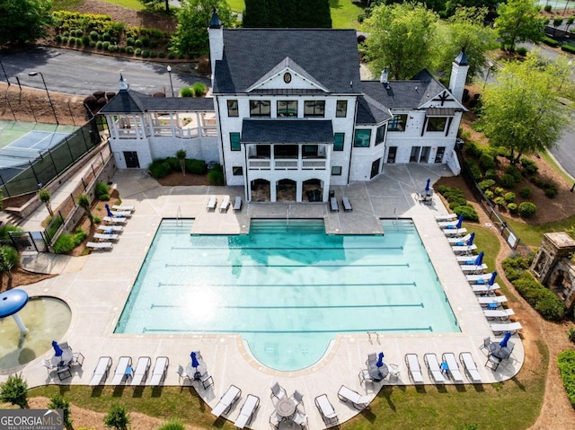 17 Ridgeline Way NW, Cartersville, GA 30121 - back of property featuring a balcony, a patio, a chimney, and a community pool