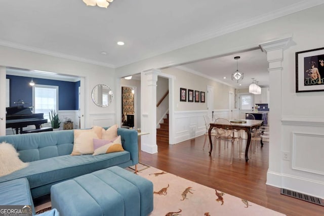 47 Roseclair Dr SE, Atlanta, GA 30317 - living room featuring wood finished floors, ornate columns, stairway, recessed lighting, and a decorative wall