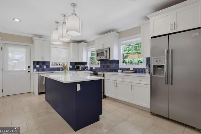 47 Roseclair Dr SE, Atlanta, GA 30317 - kitchen featuring stainless steel appliances, backsplash, white cabinets, crown molding, and recessed lighting