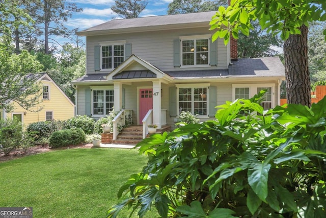 47 Roseclair Dr SE, Atlanta, GA 30317 - view of front of house with a front lawn, a chimney, and roof with shingles