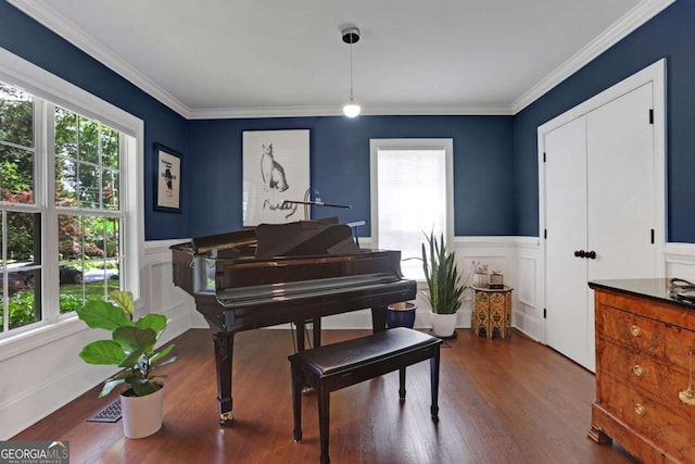 47 Roseclair Dr SE, Atlanta, GA 30317 - living area featuring healthy amount of natural light, a wainscoted wall, wood finished floors, crown molding, and a decorative wall
