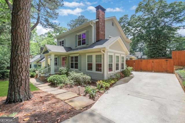 47 Roseclair Dr SE, Atlanta, GA 30317 - view of front of property with a chimney, fence, and a gate