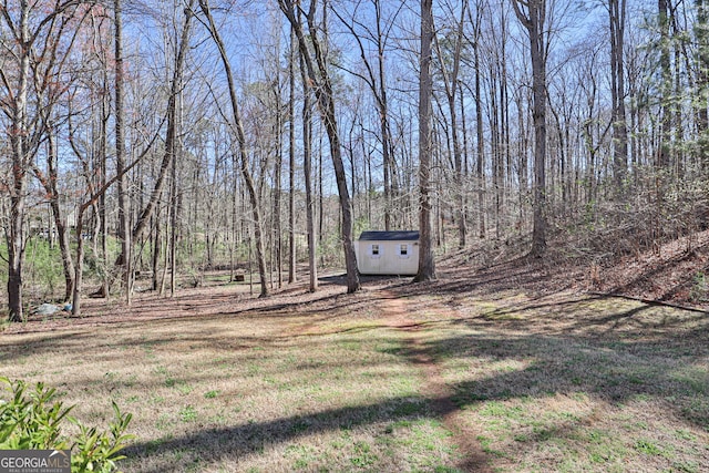 126 Cameron Pointe Dr, Lagrange, GA 30240 - view of yard with a shed and a view of trees