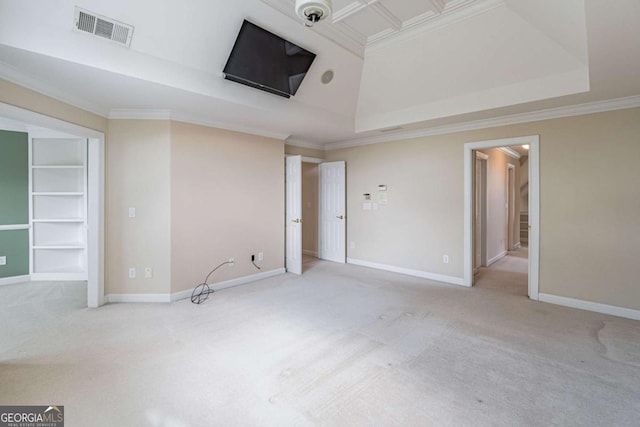 unfurnished bedroom with carpet floors, ornamental molding, baseboards, and a tray ceiling