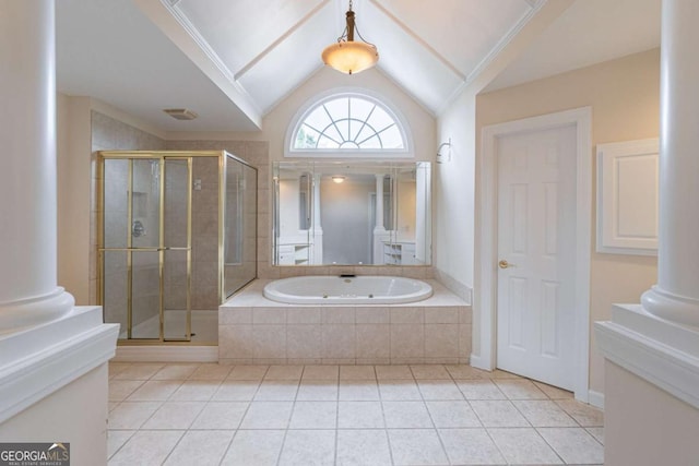 bathroom with tile patterned flooring, ornate columns, a shower stall, and lofted ceiling