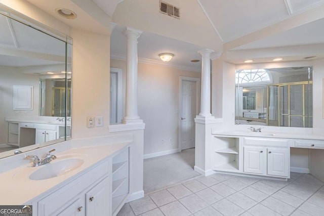 bathroom with decorative columns, tile patterned floors, a shower stall, baseboards, and ornamental molding