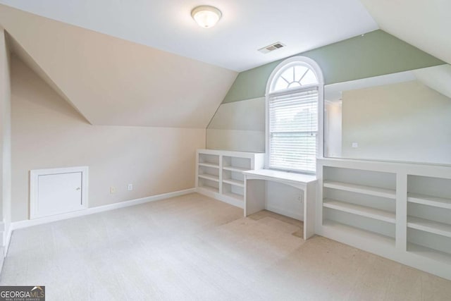 bonus room featuring carpet floors, vaulted ceiling, and baseboards