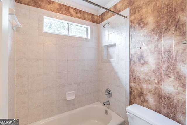 bathroom featuring crown molding, toilet, and shower / washtub combination