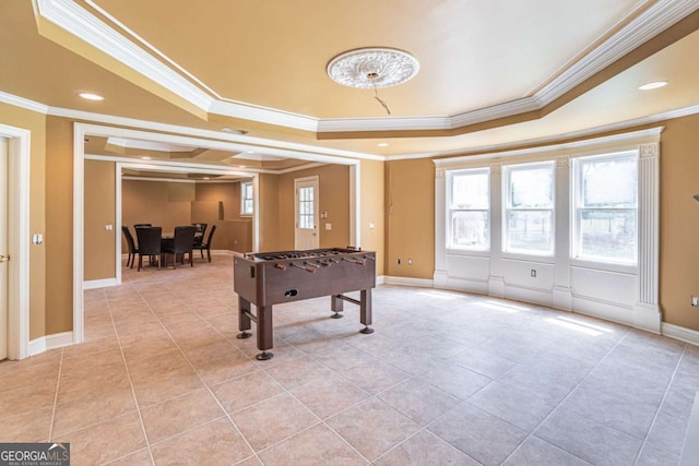 game room with a raised ceiling, crown molding, light tile patterned floors, baseboards, and recessed lighting