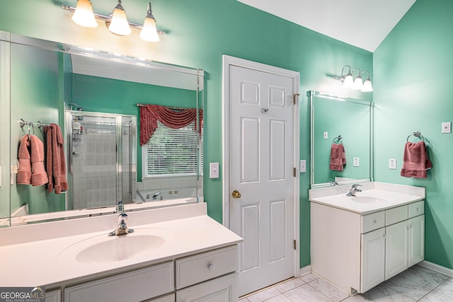 full bath featuring a stall shower, two vanities, baseboards, and marble finish floors