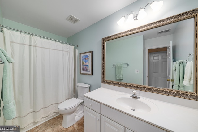bathroom with toilet and vanity