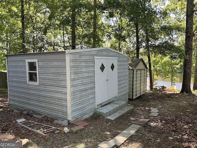 104 N Stewart Ln, Griffin, GA 30224 - view of shed featuring a water view and view of wooded area