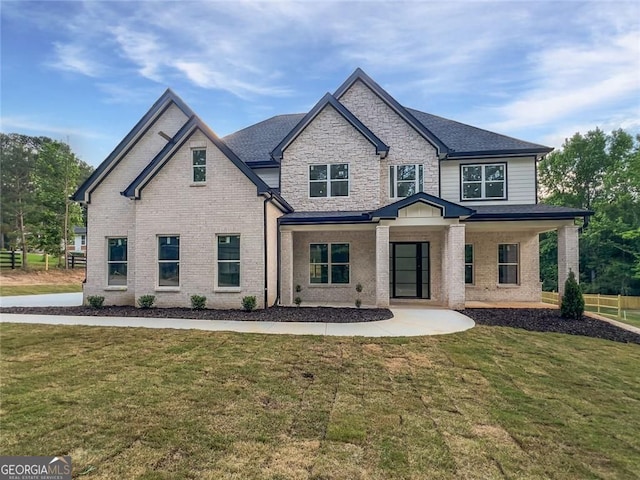 1465 Leach Dr, Lawrenceville, GA 30045 - view of front of home featuring a front yard, brick siding, and a shingled roof