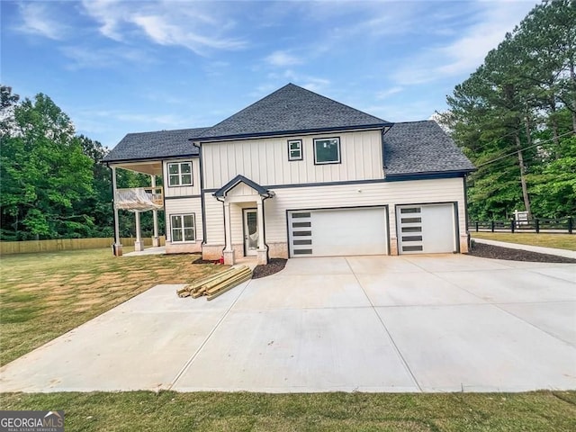 1465 Leach Dr, Lawrenceville, GA 30045 - modern inspired farmhouse featuring a balcony, roof with shingles, concrete driveway, and a garage
