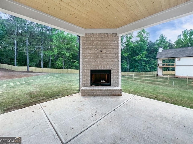 1465 Leach Dr, Lawrenceville, GA 30045 - view of patio / terrace featuring an outdoor brick fireplace and view of wooded area