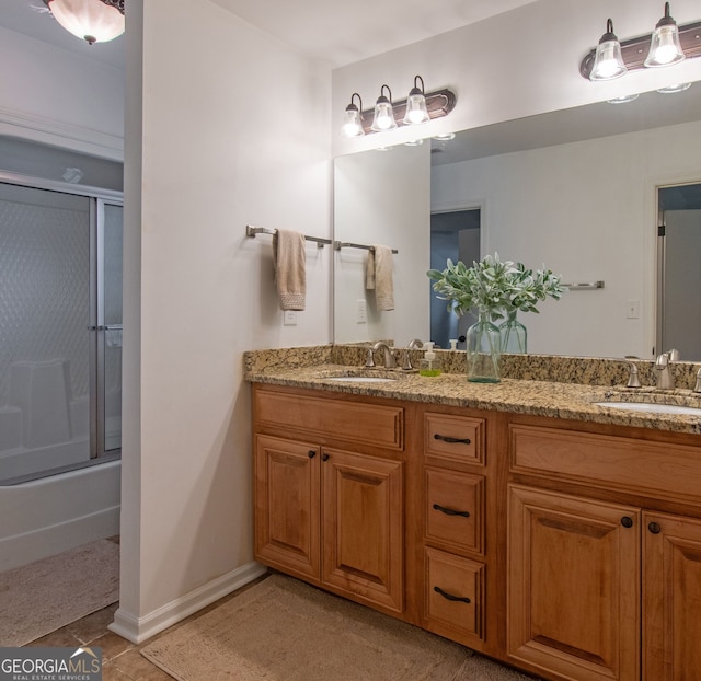 375 Luther Bailey Rd, Senoia, GA 30276 - full bath with double vanity, combined bath / shower with glass door, baseboards, and tile patterned flooring