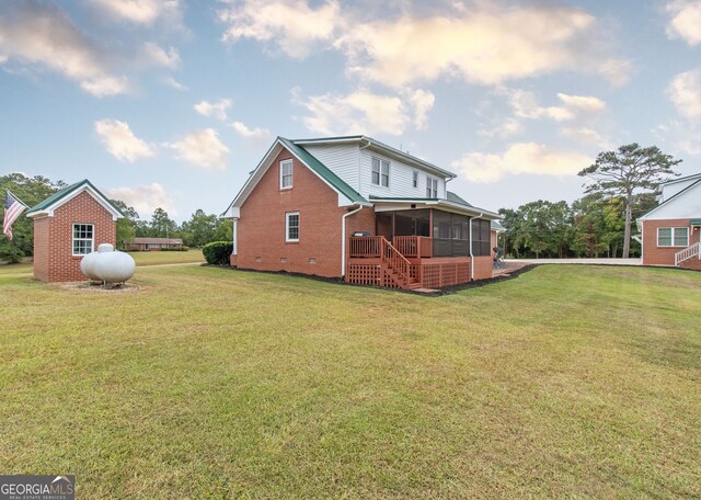 375 Luther Bailey Rd, Senoia, GA 30276 - back of house featuring a sunroom, a yard, brick siding, and crawl space