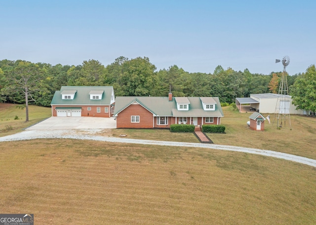 375 Luther Bailey Rd, Senoia, GA 30276 - view of front facade featuring an outbuilding, concrete driveway, a front lawn, and a wooded view