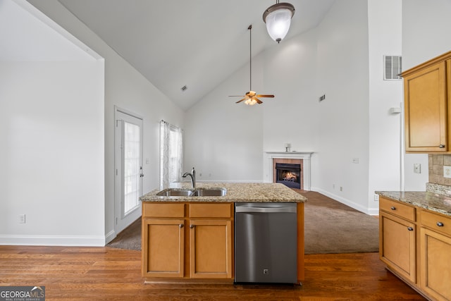 924 Vinings Dr, Winder, GA 30680 - kitchen featuring dishwasher, a sink, ceiling fan, open floor plan, and baseboards
