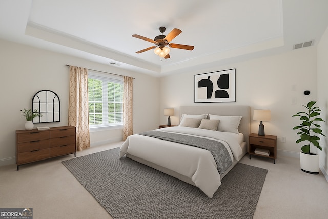 924 Vinings Dr, Winder, GA 30680 - bedroom with a raised ceiling, light colored carpet, and baseboards