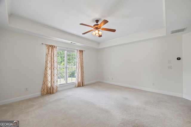924 Vinings Dr, Winder, GA 30680 - empty room featuring a tray ceiling, ceiling fan, carpet, baseboards, and ornamental molding