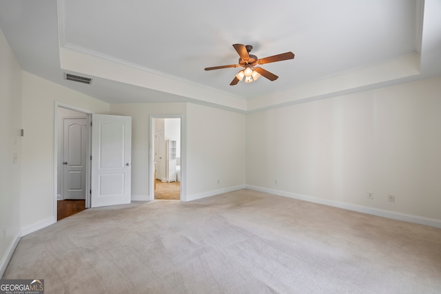 924 Vinings Dr, Winder, GA 30680 - unfurnished bedroom featuring a tray ceiling, carpet flooring, baseboards, ornamental molding, and ensuite bath