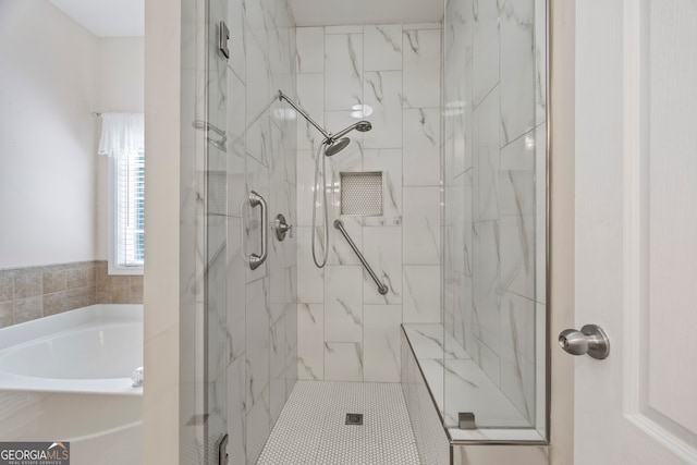 924 Vinings Dr, Winder, GA 30680 - bathroom with a marble finish shower and a bath