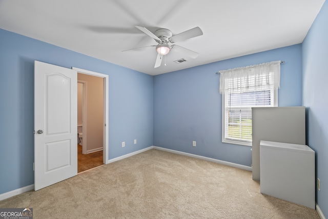 924 Vinings Dr, Winder, GA 30680 - unfurnished bedroom with carpet flooring, baseboards, and a ceiling fan