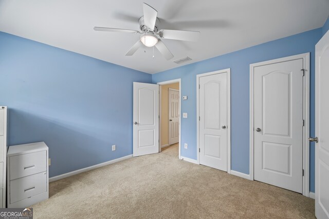 924 Vinings Dr, Winder, GA 30680 - unfurnished bedroom featuring carpet flooring, baseboards, and ceiling fan