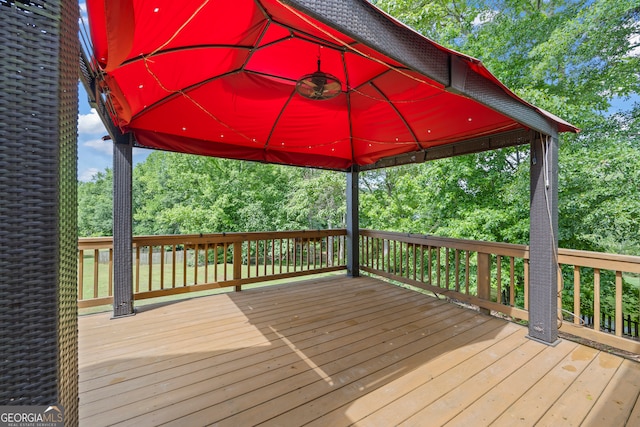 924 Vinings Dr, Winder, GA 30680 - wooden deck with a gazebo and view of wooded area