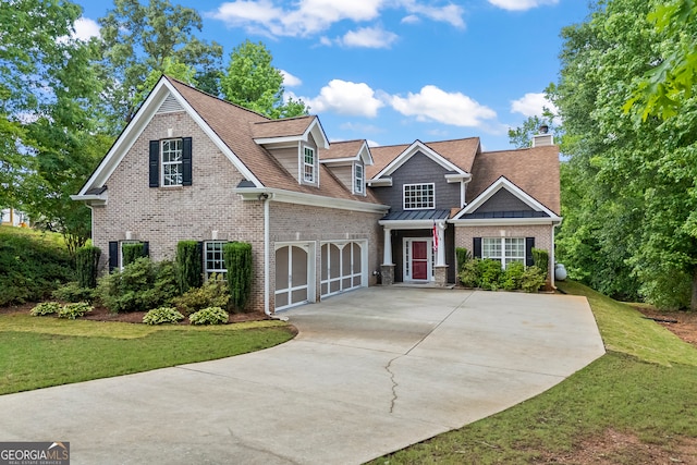 924 Vinings Dr, Winder, GA 30680 - view of front of house with concrete driveway, a front lawn, brick siding, a chimney, and a shingled roof