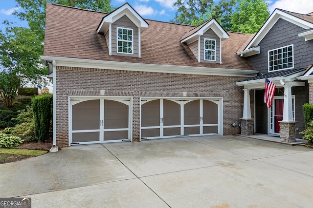 924 Vinings Dr, Winder, GA 30680 - view of front of property with concrete driveway, brick siding, and a shingled roof