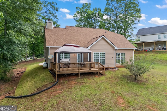 924 Vinings Dr, Winder, GA 30680 - back of house featuring a gazebo, a yard, a chimney, and a wooden deck