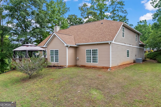 924 Vinings Dr, Winder, GA 30680 - rear view of house featuring a gazebo, a chimney, a yard, roof with shingles, and cooling unit