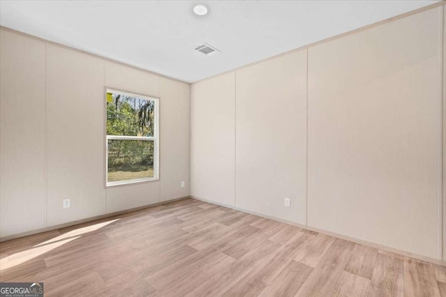 empty room with light wood-type flooring
