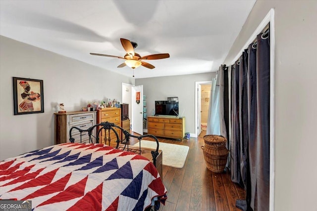 bedroom with hardwood / wood-style floors and a ceiling fan