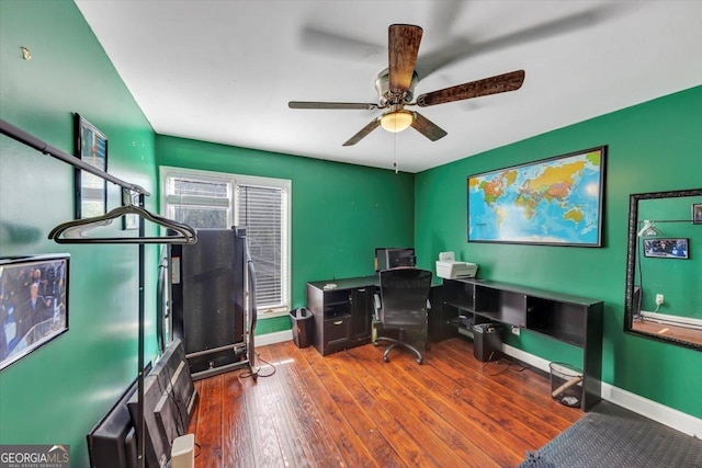 office with hardwood / wood-style floors, a ceiling fan, and baseboards