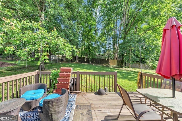 wooden deck featuring outdoor dining space