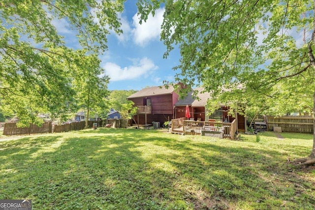view of yard with a wooden deck