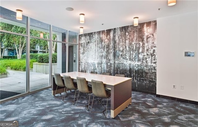 950 W Peachtree St NW Unit 1613, Atlanta, GA 30309 - carpeted dining area with expansive windows and baseboards