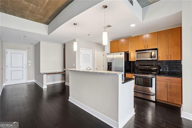 950 W Peachtree St NW Unit 1613, Atlanta, GA 30309 - kitchen with appliances with stainless steel finishes, dark wood-style flooring, baseboards, brown cabinets, and tasteful backsplash