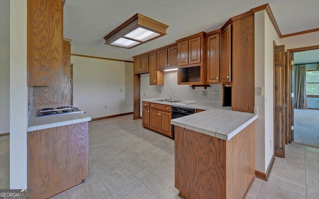 kitchen with crown molding, brown cabinets, cooktop, decorative backsplash, and baseboards