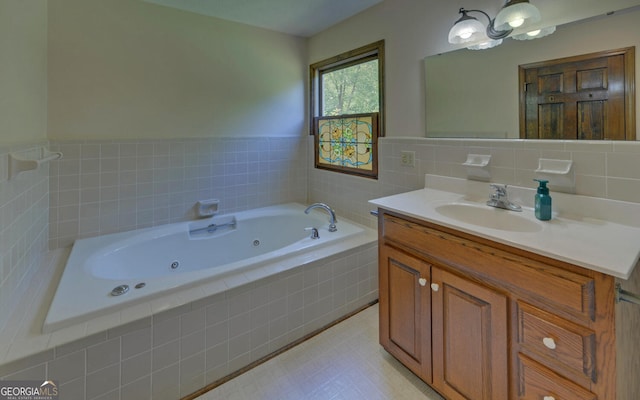 bathroom with a whirlpool tub and vanity