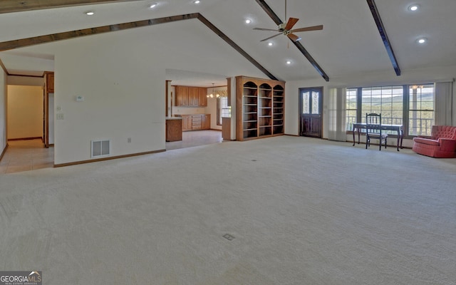 unfurnished living room with light colored carpet, baseboards, high vaulted ceiling, beam ceiling, and a chandelier