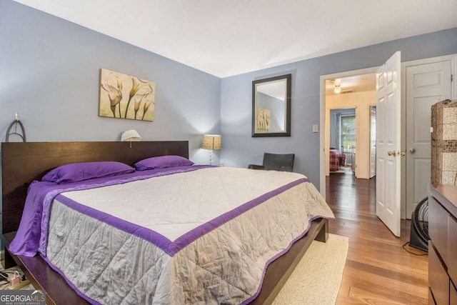 bedroom featuring wood finished floors