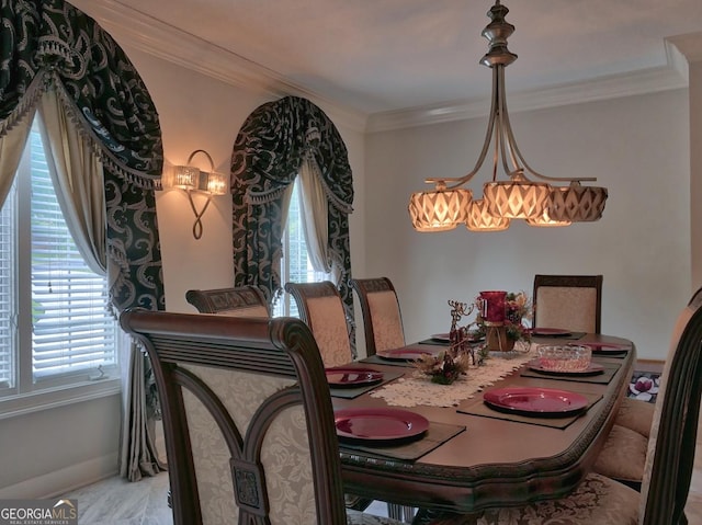 205 Somerset Ct, Mcdonough, GA 30253 - dining area featuring a chandelier, ornamental molding, and baseboards