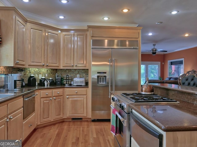 205 Somerset Ct, Mcdonough, GA 30253 - kitchen with high end appliances, ceiling fan, light brown cabinets, recessed lighting, and light wood-style floors